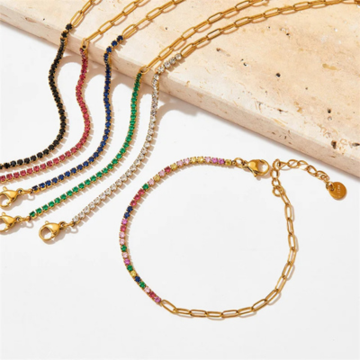 "FAE Set med Spenne og Tennisarmbånd" can be rewritten as "FAE Spenne og Tennisarmbånd Set".